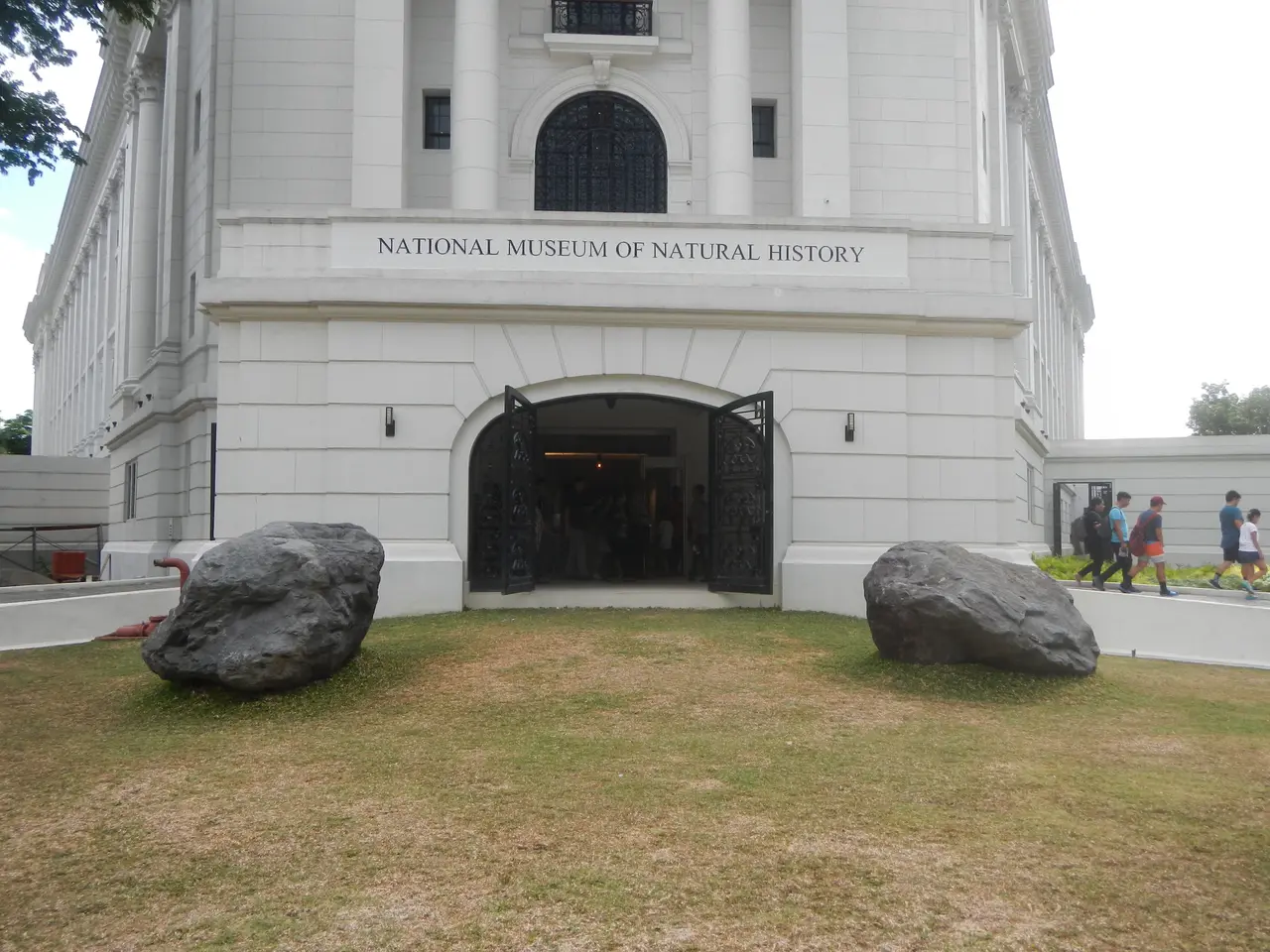 The image shows the National Museum of Natural History in Manila, Philippines. It is a large...