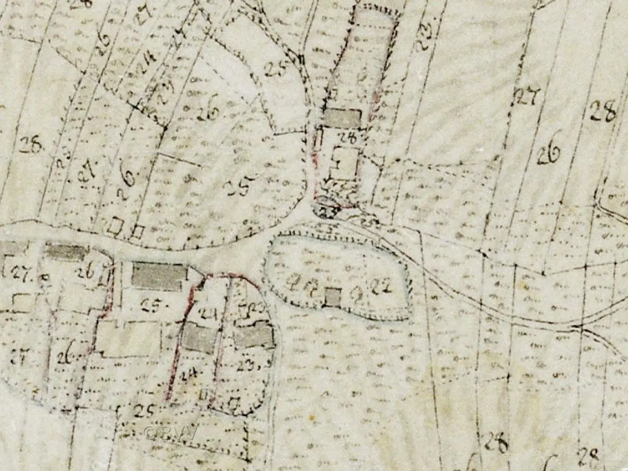 The image shows an old map of a city with a lot of buildings, numbers, and text. It is believed to...