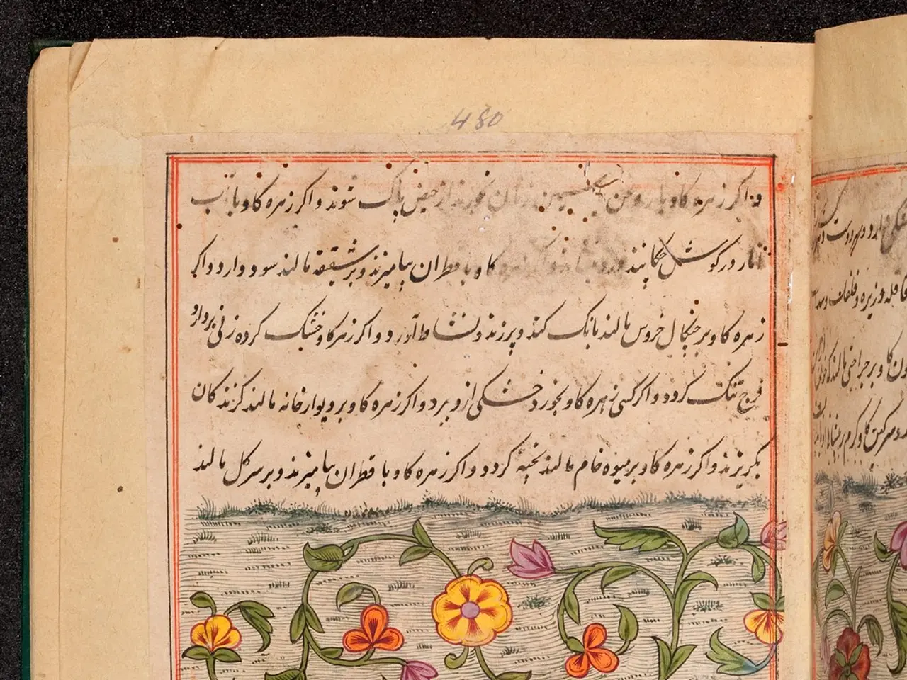 The image shows an open book with Arabic writing on it and a painting of flowers and leaves on the...