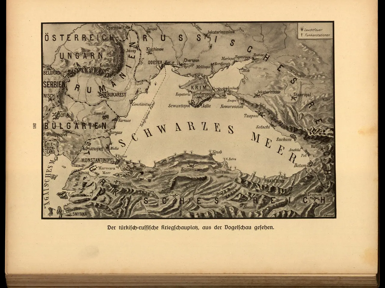 The image shows an old book with a black background and a map of the world on it. The map is...