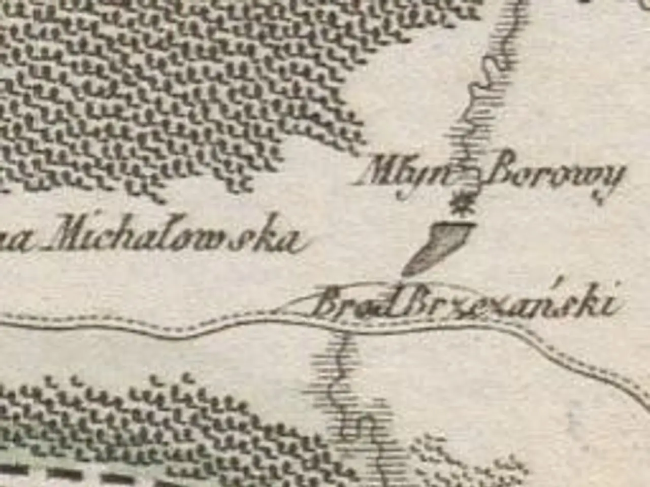 The image shows an old map of the city of Minsk, Belarus, with text written on it. The map is...