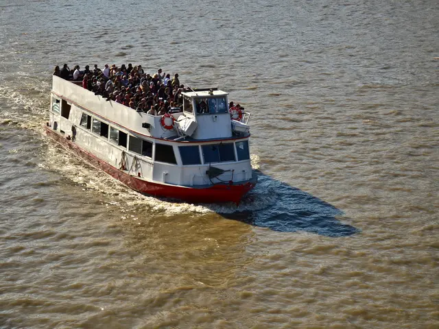 In the image there is a ship sailing on the water surface and on the top of the ship there are a...