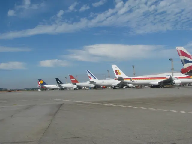 In this image there are few flights on the runway, there are few poles and cables and some clouds...
