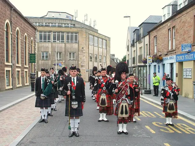 This picture describes about group of people, few people standing on the road and few people...