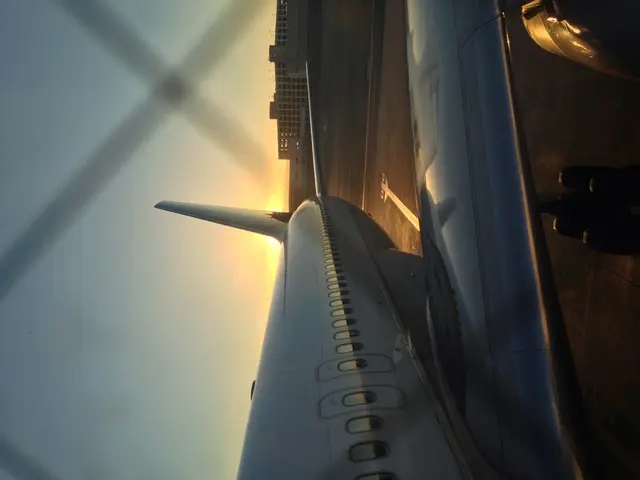 There is a flight with windows. In the back there are buildings and sky.