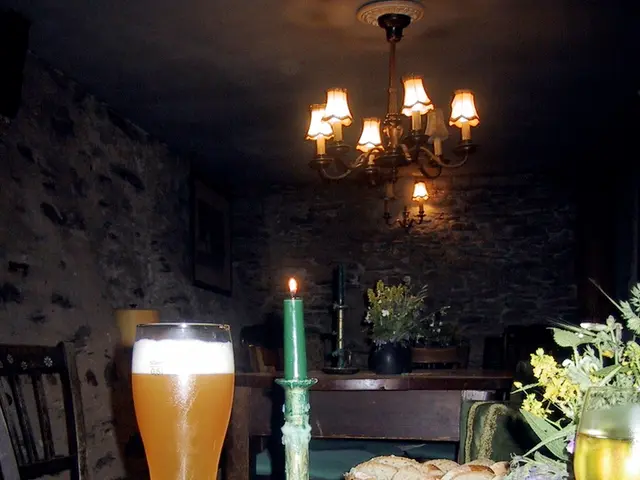 This is a picture taken in a restaurant, this is a wooden table on the table there are bowl, glass,...