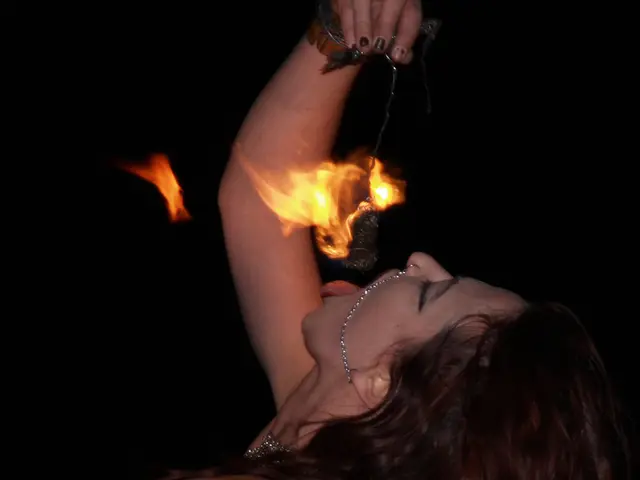 Here in this picture we can see a woman standing over a place and she is trying to eat something...