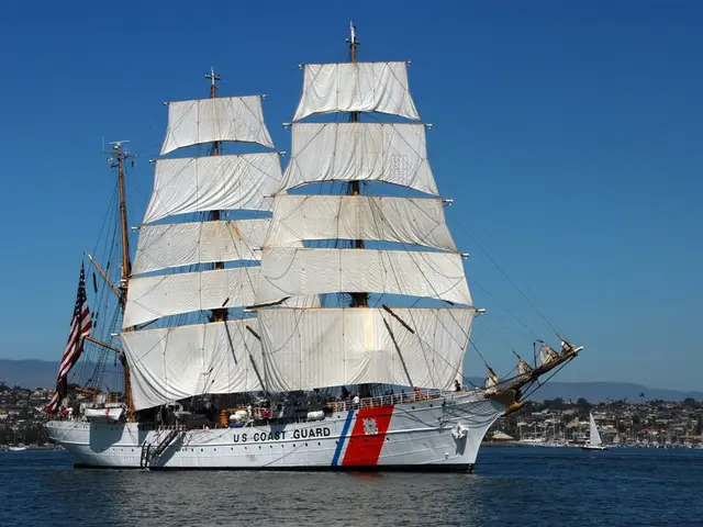 In the center of the image we can see ships on the water. In the background there are buildings,...