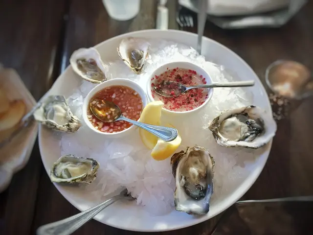 In the picture we can see a plate on the wooden table and on it we can see a plate with rice and...