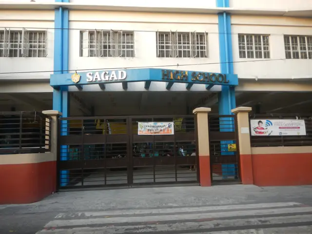The image shows the Sagad High School in Manila, Philippines. It is a building with windows,...