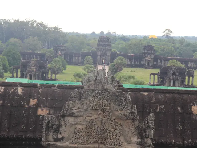 The image shows Angkor Wat in Siem Reap, Cambodia, with its ancient architectures, sculptures on...