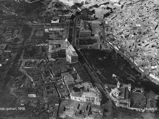 The image shows an aerial view of the city of Baku, Azerbaijan in 1918. It is a black and white...