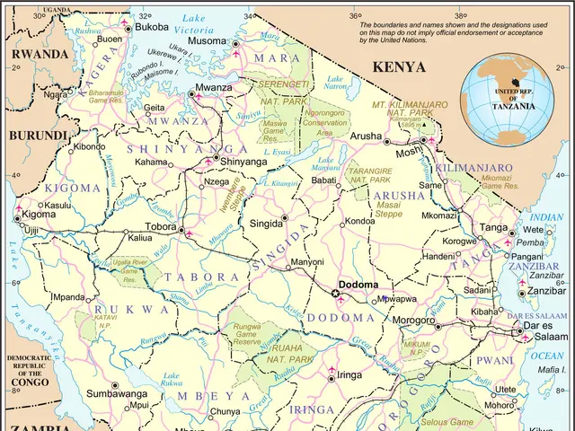 The image shows a poster of a political map of Tanzania, with text and a globe. The map is...