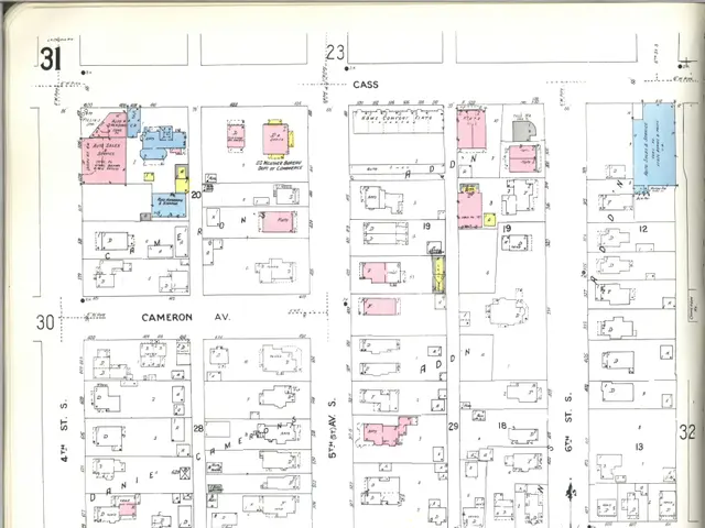 The image shows an old book with a map of a city on it. The map is from the 1920s and shows the...