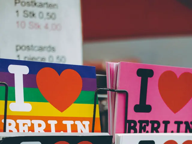 The image shows a rack with a variety of books and posters with the words "I Love Berlin" written...