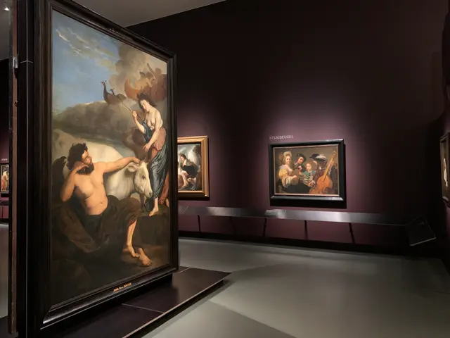 The image shows a room filled with paintings on display in a museum, with photo frames on the walls...