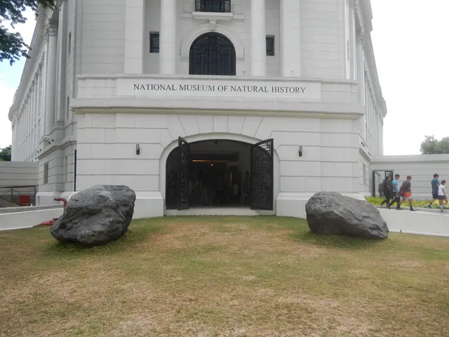 The image shows the National Museum of Natural History in Manila, Philippines. It is a large...