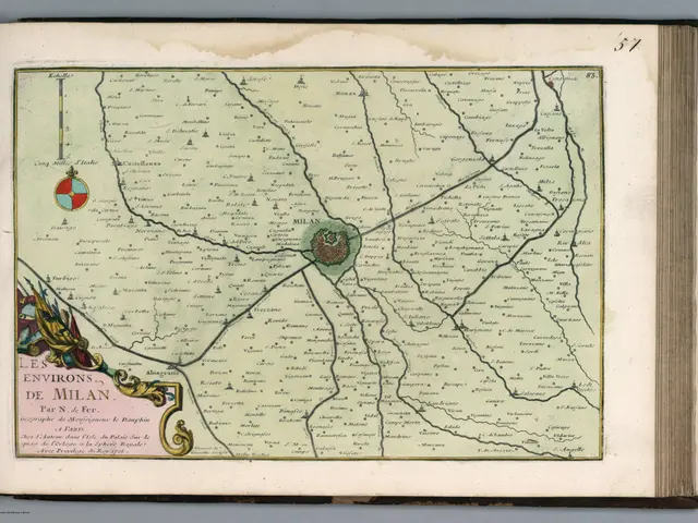 The image shows an open book with a map of the city of Milan on it. The map is detailed and shows...