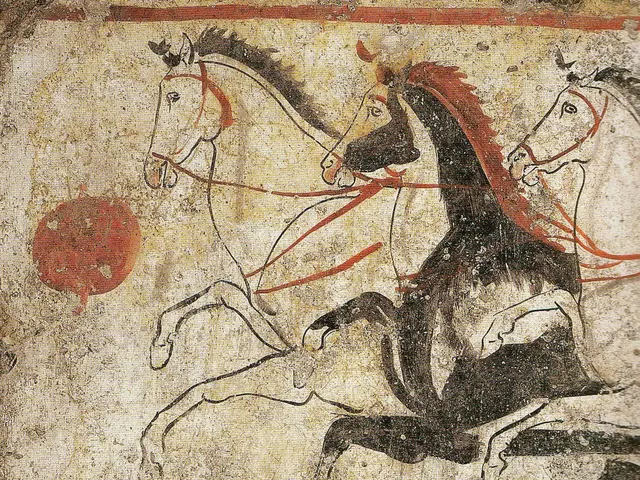 The image shows a painting on the wall of a house in Pompeii, Italy, depicting two horses galloping...