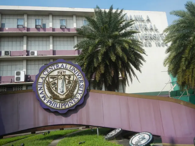 The image shows the entrance to the Manila Central University in Manila, Philippines, with a logo...