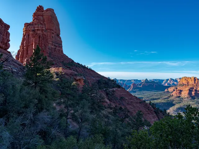 The image shows the breathtaking beauty of Sedona, Arizona, with its red rock formations, trees,...