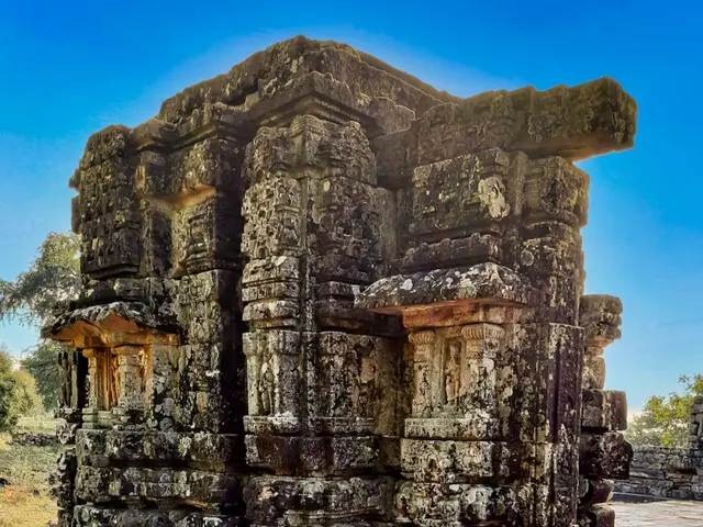 The image shows the ruins of the ancient Khmer temple in Angkor Thom, Cambodia. The temple is made...