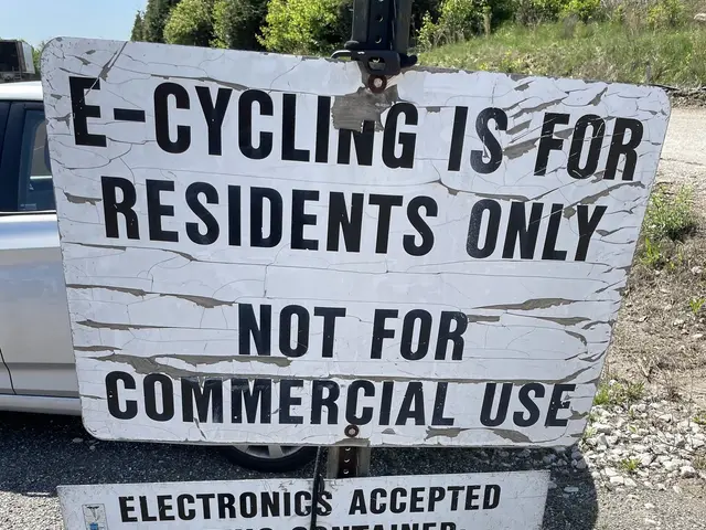 The image shows a sign that reads "e-cycling is for residents only" sitting on the side of a road,...