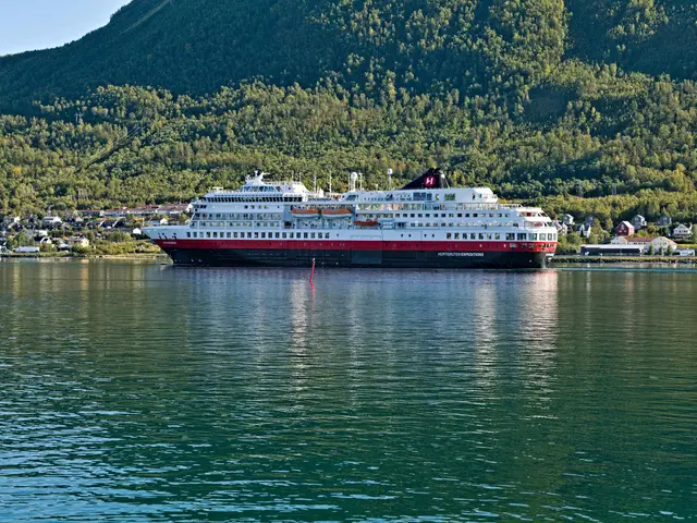 The image shows a large cruise ship, the Norwegian Cruise Line's Norwegian Explorer, floating on...