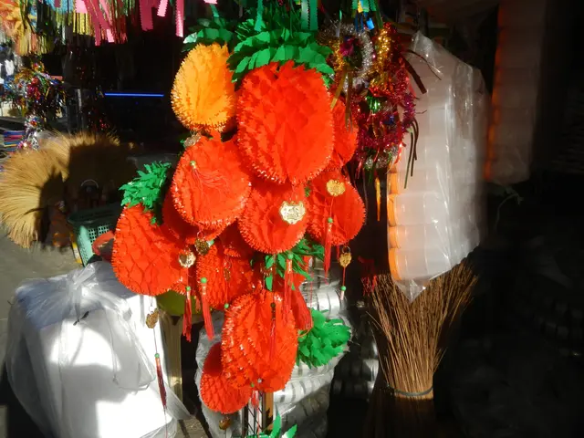 The image shows a vibrant display of Chinese New Year decorations for sale at a market. There are...