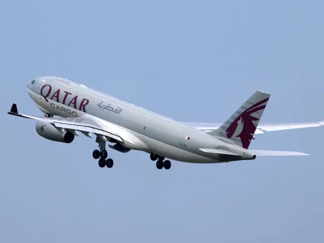 The image shows a Qatar Airways Airbus A330-300 in flight, with its white and maroon livery...