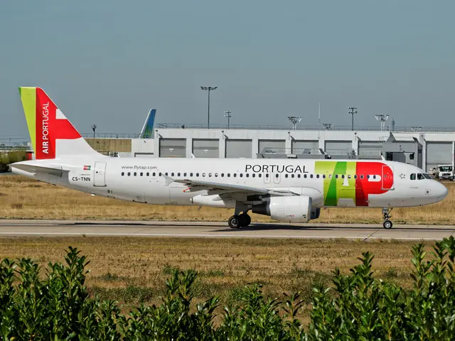 The image shows a Portugal Airlines Airbus A320-200 on the runway at Lisbon Airport, surrounded by...