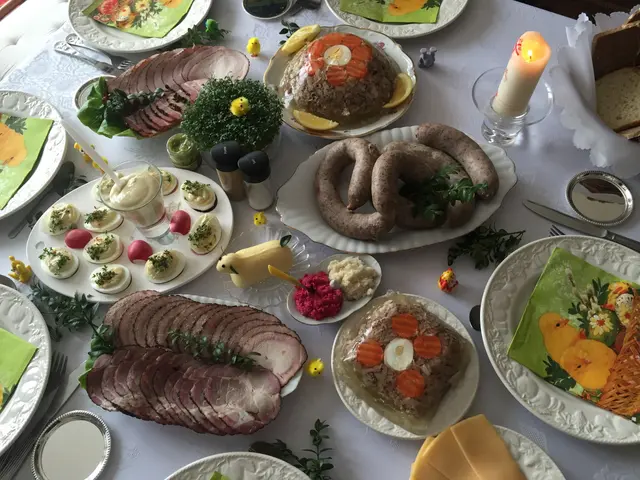 The image shows a table topped with lots of different types of food, including plates, bowls,...