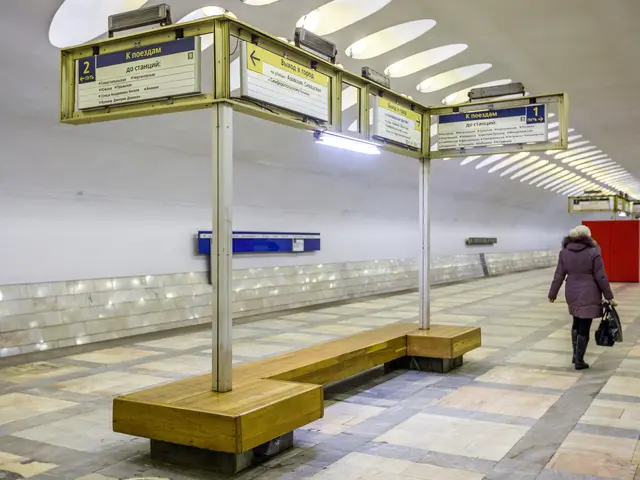 The image shows a woman walking through a subway station in Moscow, Russia. She is wearing a coat...