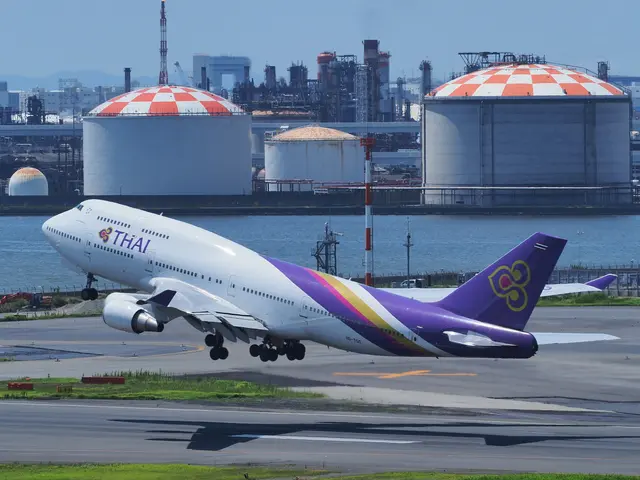 The image shows a Thai Airways Boeing 747-400 taking off from an airport runway, surrounded by...
