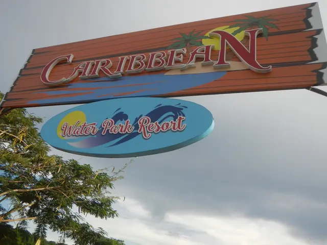 The image shows a board with the words "Caribbean Water Park Resort" written on it, surrounded by...