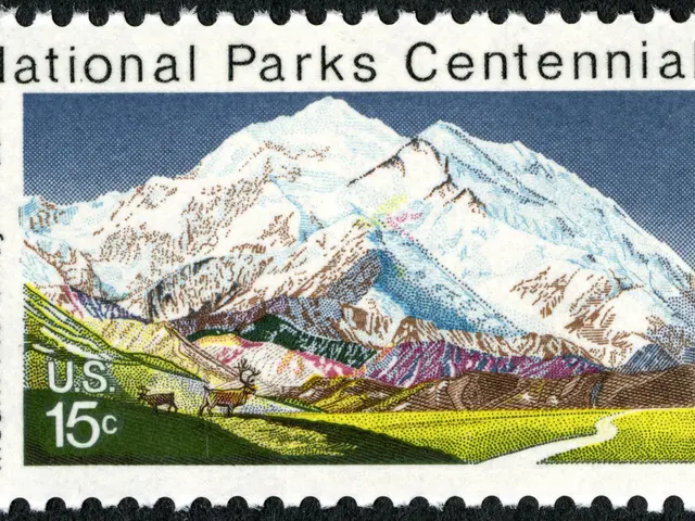 The image shows a postage stamp with the words "National Parks Centennial" printed on it, featuring...
