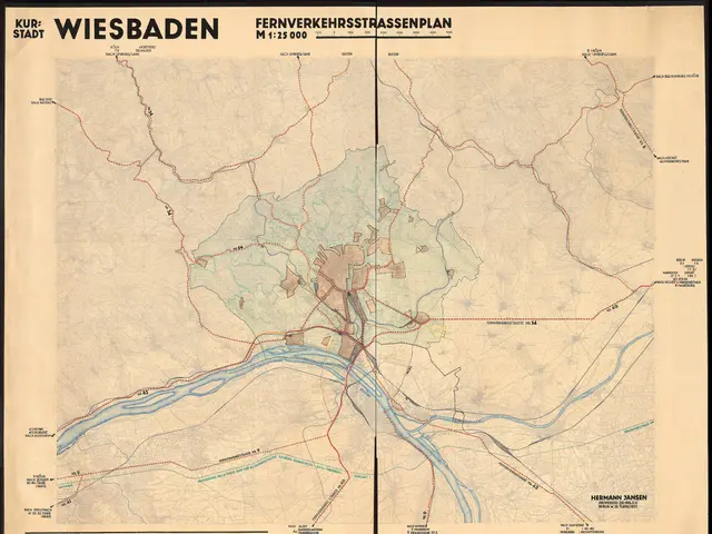 The image shows an old map of the city of Wiesbaden, Germany, framed in a photo frame. The map is...