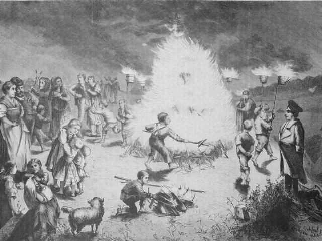 The image shows a group of people standing around a bonfire, with some of them holding sticks in...
