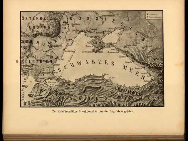 The image shows an old book with a black background and a map of the world on it. The map is...